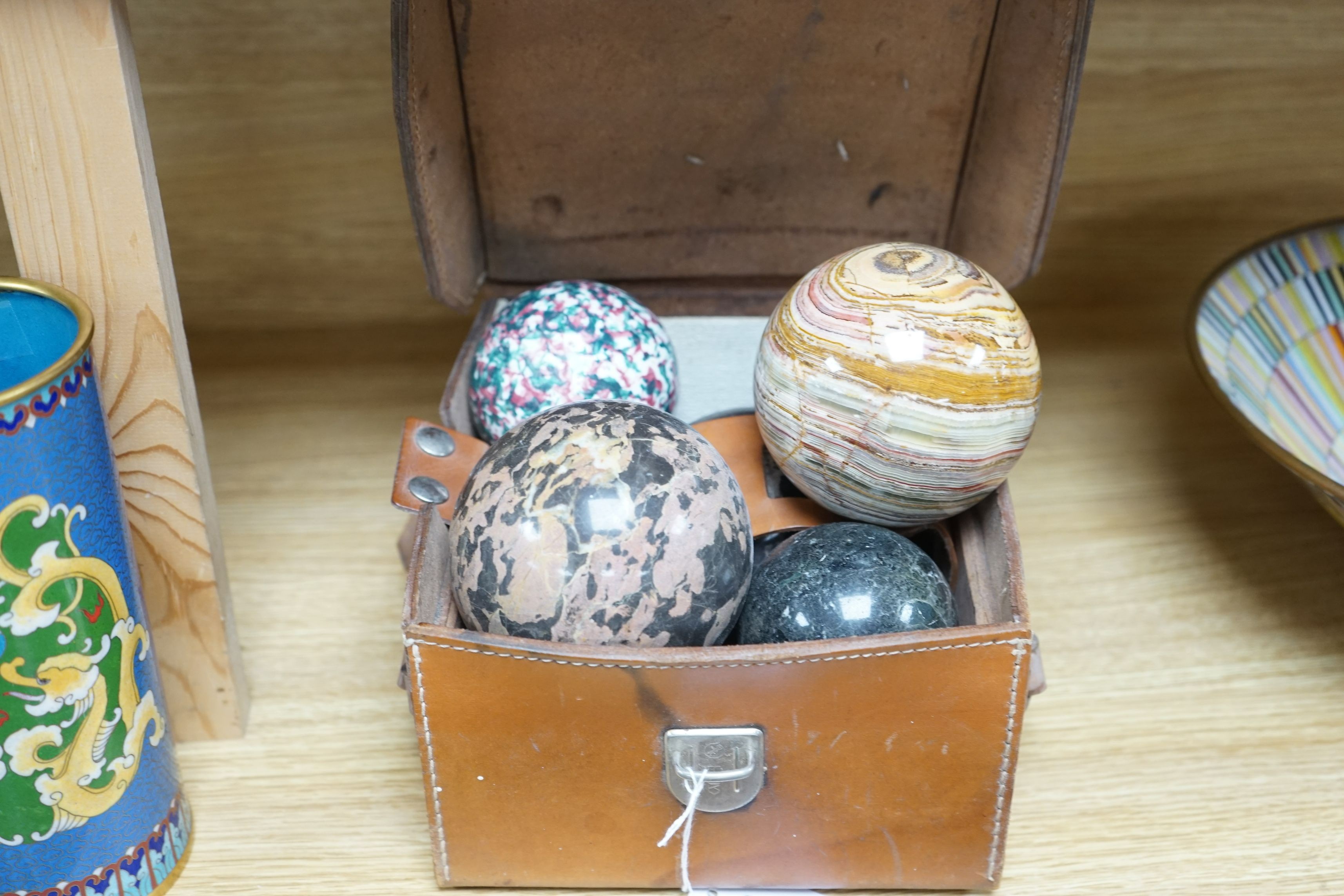 A collection of polished semi-precious stone eggs and balls